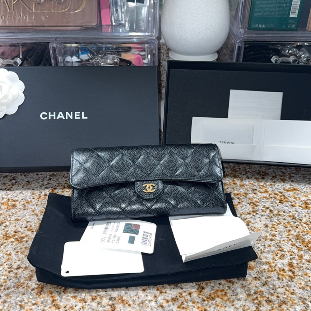 CHANEL Black Quilted Wallet with Gold Accent